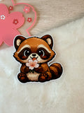 A Tanuki Situation Die-cut Sticker - Holding Sakura